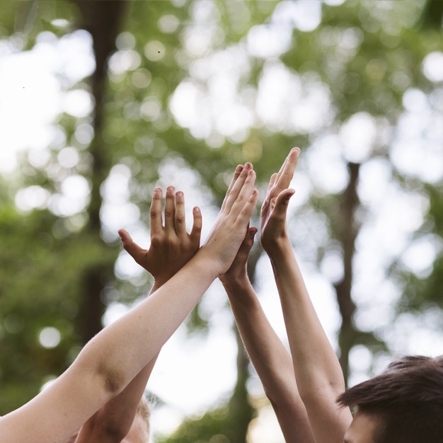 low-angle-kids-high-fiving_23-2148210489.jpg